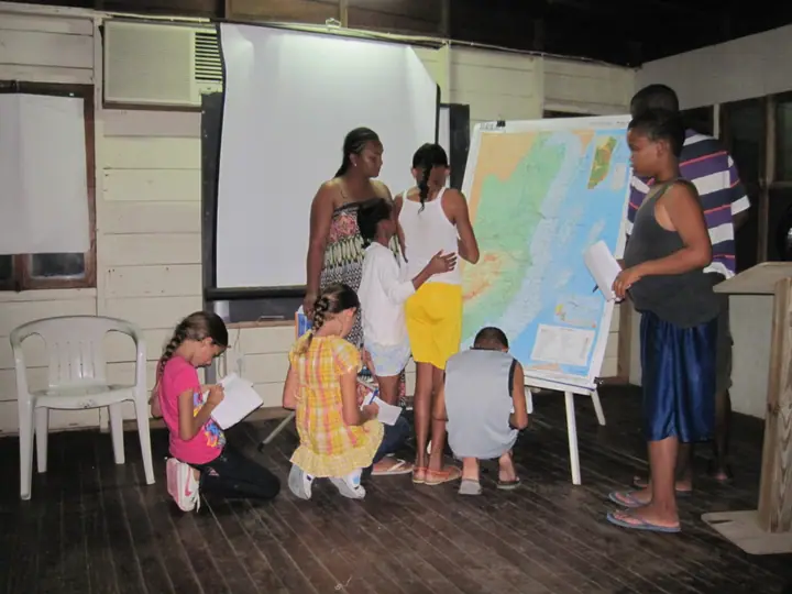 A lesson with a map on the wall