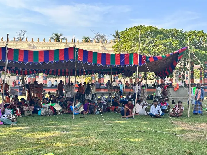 The whole group gathered together under a decorated tent