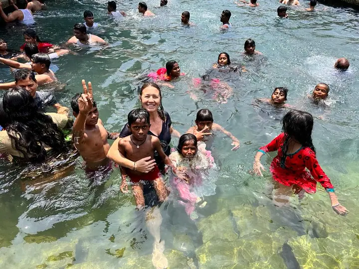 Kids splashing in a temple pool