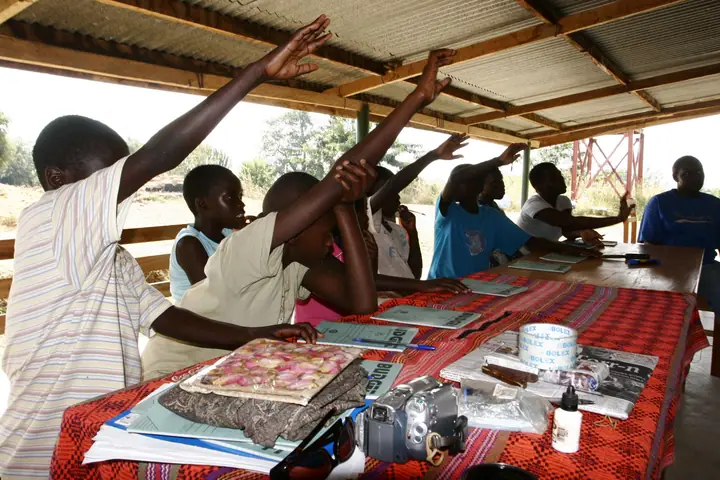 A lesson under the open-air shelter at camp